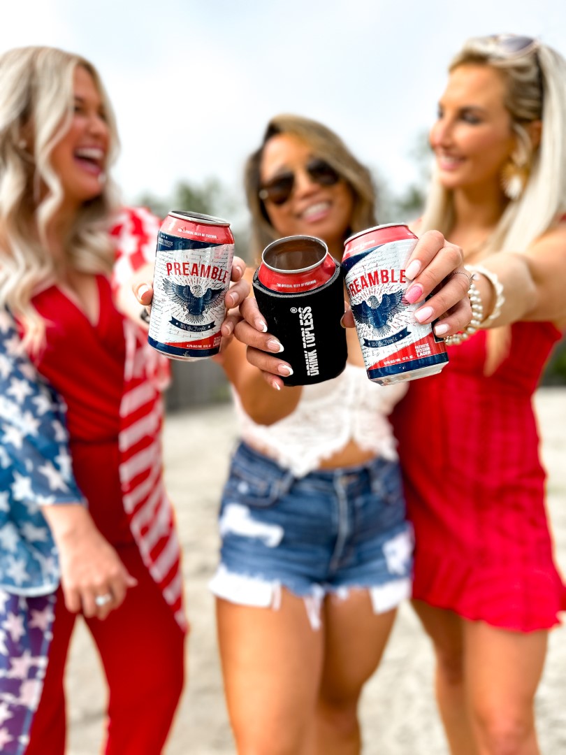 Three women cheering their beverages happy 